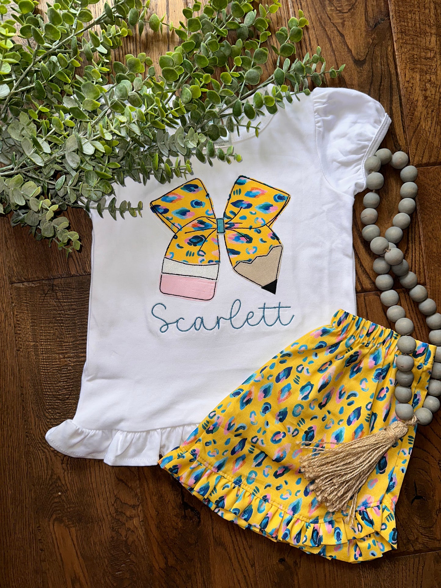 Yellow cheetah bow pencil with name shirt and Shorts